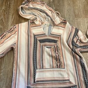 Small hooded long sleeve shirt.
